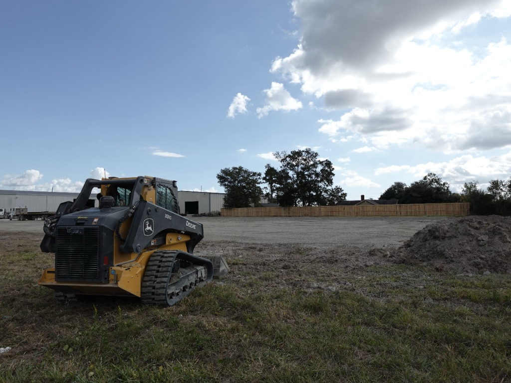 John Deere skid steer on job site