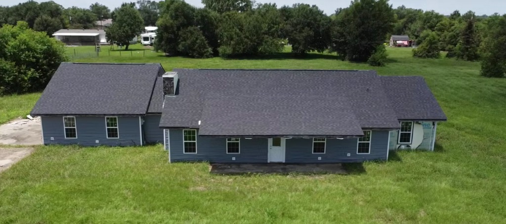 Aerial view of a Louisiana home sitting on open acreage